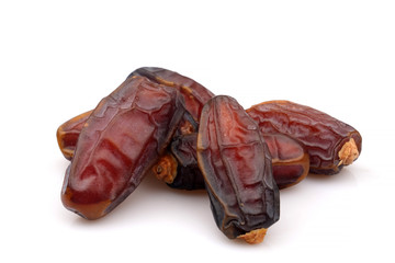 Organic and Fresh Medjool dried Dates, close-up, isolated on white background.