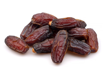 Organic and Sweet dates on white background. Dried fruit as healthy snack