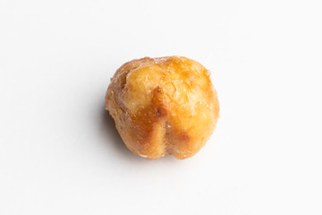 Roasted hazelnut in caramel isolated on a white background
