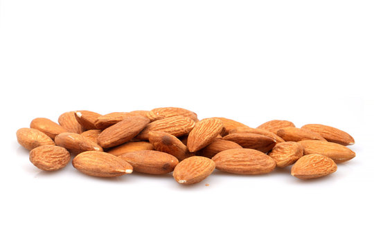 Group of organic almonds isolated on white background