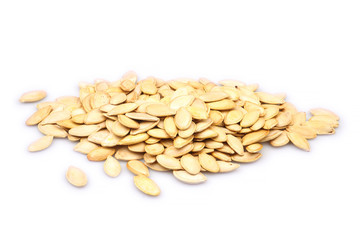 Heap of organic pumpkin seeds isolated on white background
