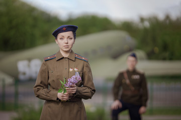 Young adult man and woman in the uniform of pilots of the Soviet Army of the period of World War...