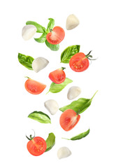 Mozzarella cheese balls, tomatoes and basil leaves falling on white background. Caprese salad