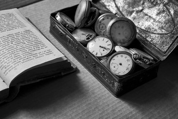 old pocket watch and book