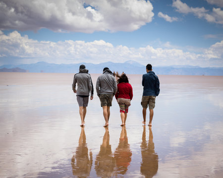 People walking through the Salinas Grandes in Jujuy, Argentina