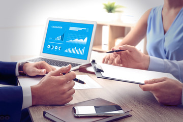 People working at table in office, closeup. Business analytics