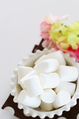 Fototapeta na wymiar Marshmallow In bowl on white background with copy space