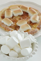 Marshmallow and sugar pizza on dish for sweet food