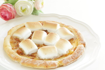 Marshmallow and sugar pizza on dish for sweet food