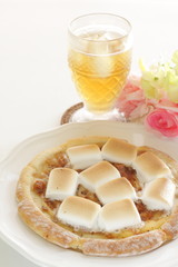 Marshmallow and sugar pizza on dish for sweet food