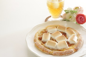 Marshmallow and sugar pizza on dish for sweet food