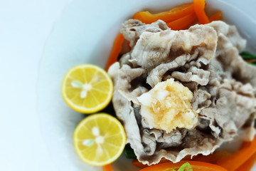 Japanese food, boiled pork slice served with lemon and vegetable