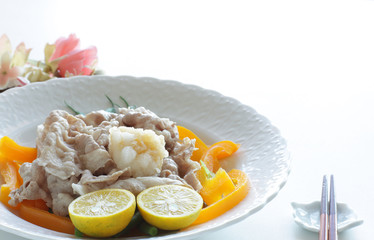 Japanese food, boiled pork slice served with lemon and vegetable
