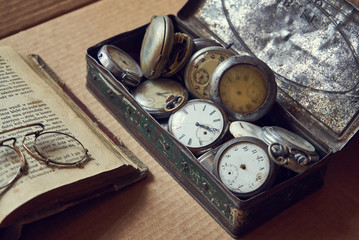 old pocket watch and book