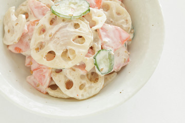 Homemade lotus root and mayonnaise salad with cucumber and carrot