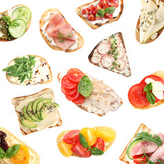 Set of delicious toasted bread with different toppings on white background, top view