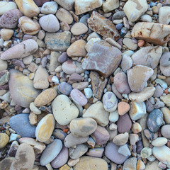 Close up of rounded and polished beach rocks