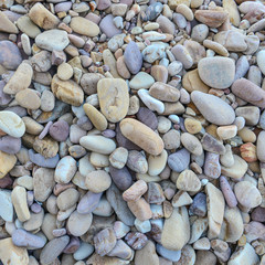 Close up of rounded and polished beach rocks