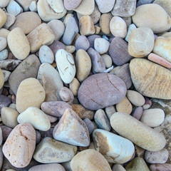 Close up of rounded and polished beach rocks