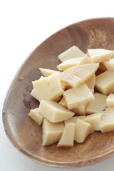 Boiled bamboo shoots on wooden plate with copy space