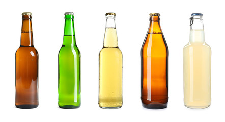Set with different bottles of beer on white background