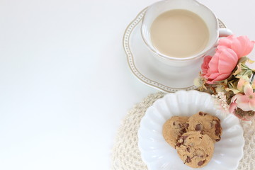 Chocolate chips on white dish with copy space