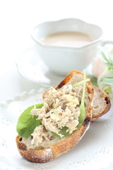 Tuna fish and baby leaves open sandwich for healthy breakfast