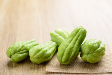 Chayote squash or Mirlition squash on wooden background, Organic vegetable, Edible plant fruit
