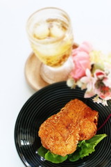 Fried chicken on white dish with copy space