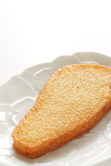 Chinese food, fish cake on white dish