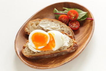 soft boiled egg on cream cheese toast for gourmet comfort breakfast