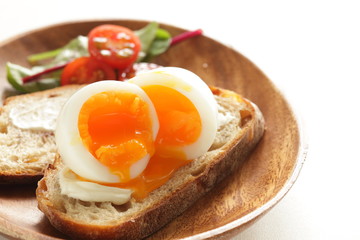 soft boiled egg on cream cheese toast for gourmet comfort breakfast