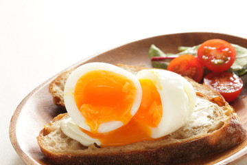 soft boiled egg on cream cheese toast for gourmet comfort breakfast