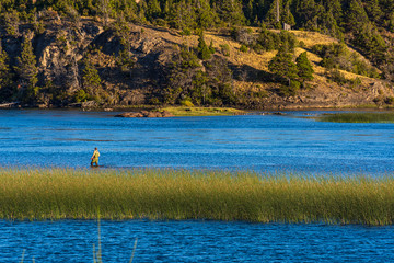 Scene view of people fishing at Río Grande (Futaleufú river) in Los Alerces National Park, Patagonia, Argentina