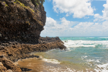Waves pounding a rocky shore - 351751977