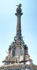 Vertical Panoramic Christopher Columbus Monument at the La Rambla Water Front of Barcelona, Spain. Blue sky background. 