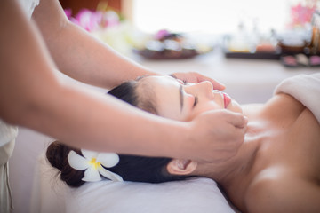 Obraz na płótnie Canvas Body care. Spa body massage Asian woman hands treatment. Woman having massage in the spa salon