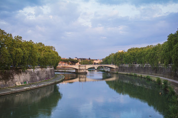 Rome city view with tiber river at dusk