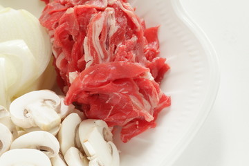 Raw food ingredient, beef and onion with sliced mushroom,