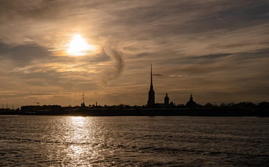 Fototapeta na wymiar Russia, Saint Petersburg. Peter and Paul fortress and the Neva river at sunset in Saint Petersburg. 