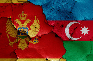 flags of Montenegro and Azerbaijan painted on cracked wall