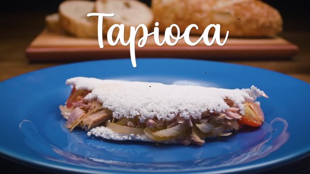 A typical Brazilian food, Tapioca. Beside it appears written in Portuguese: Tapioca