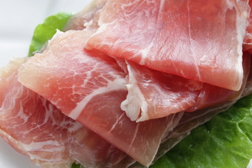 sliced ham on plate with copy space for gourmet