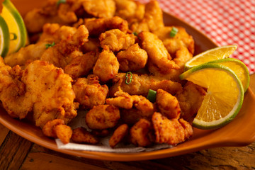 portion made of breaded chicken breast strips