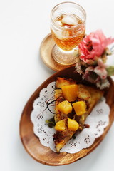 Piece of tropical fruit mango and beef Pizza on wooden plate