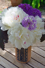 Bouquet of fragrant white and pink peony, allium and heuchera flowers