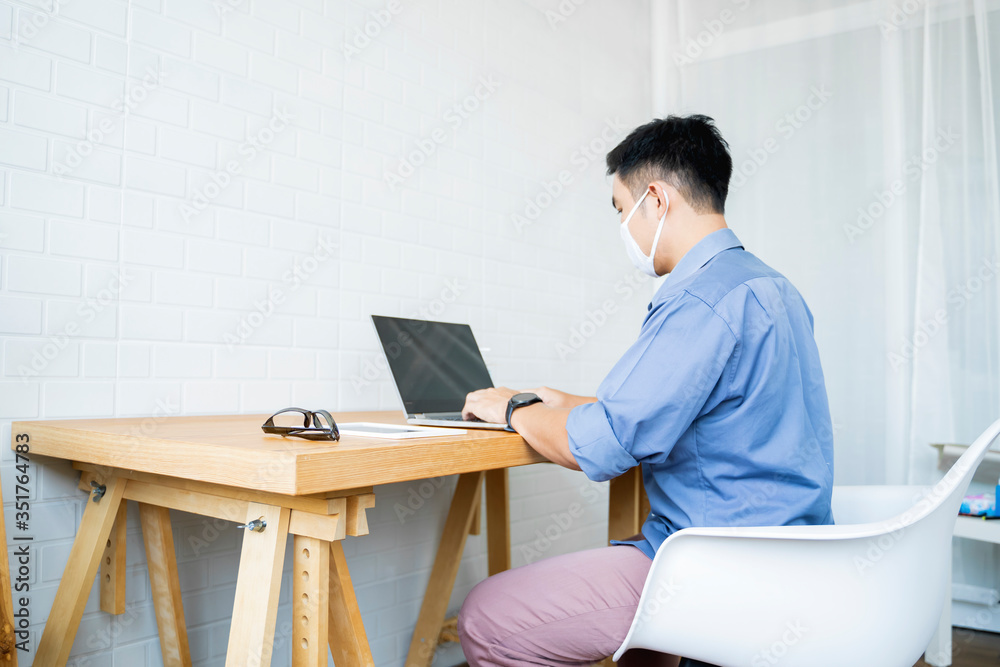 Fototapete Working from home web designing graphical user interface UX UI, home office using computer laptop and pen sketching graphics tablet device creative planning innovative ideas, asian man quarantine
