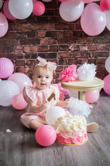 little girl with pink balloons
