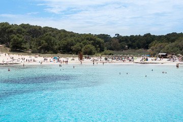 Beach with people and sea landscape in Santanyi, Majorca