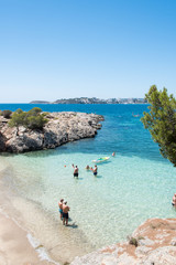 Beach with people and sea landscape in Punta Negra, Calvia, Majorca